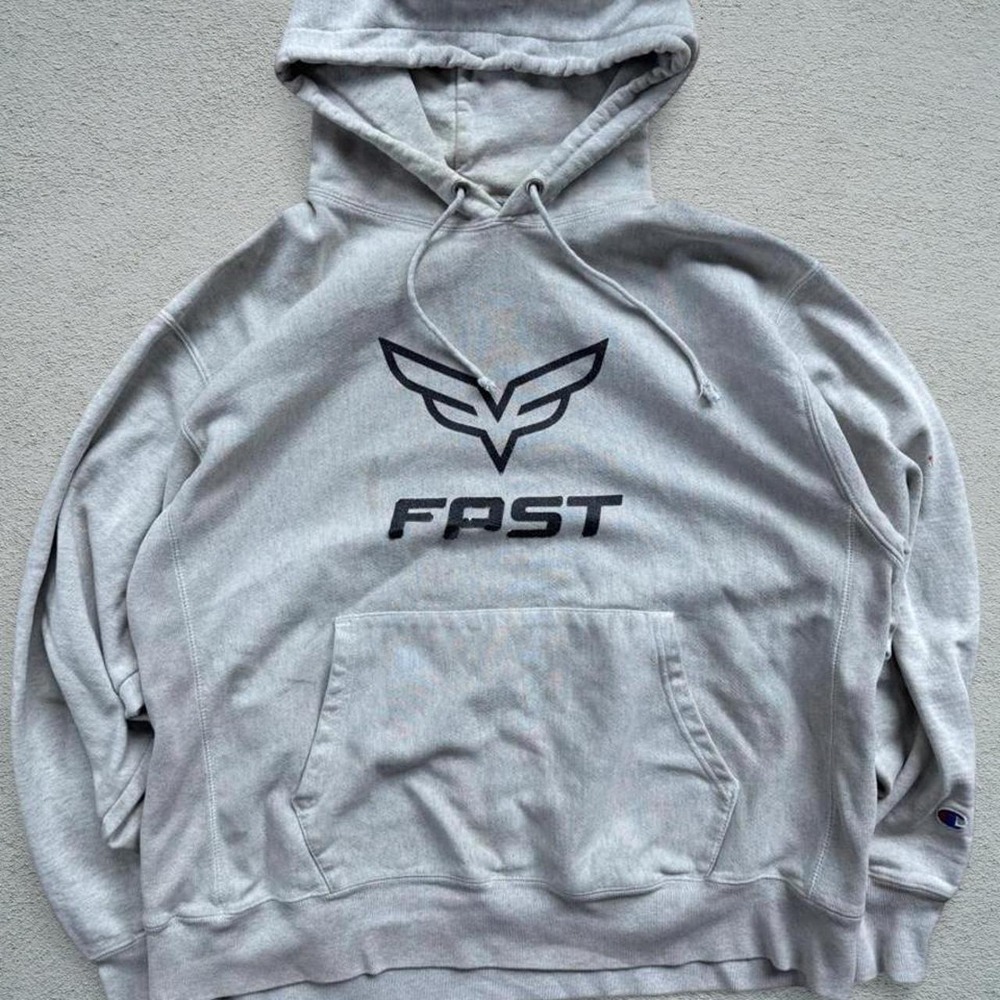 Gray Champion reverse weave hoodie with black 'FAST' text and logo